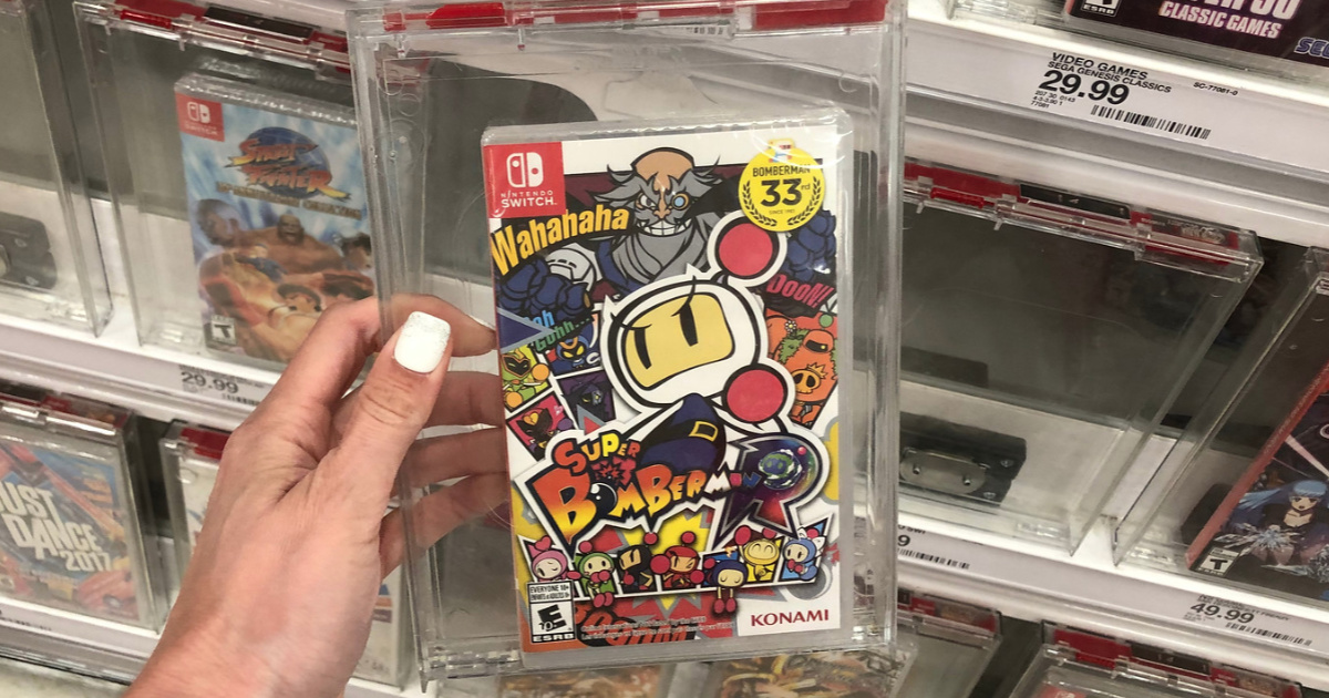 Hand olding Super Bomberman Nintendo Switch Game in store