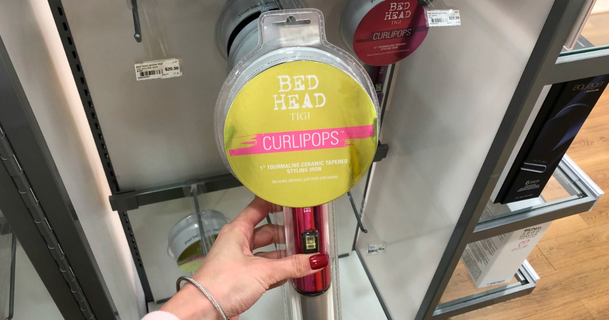 hand holding bed head curling wand on shelf at ulta store