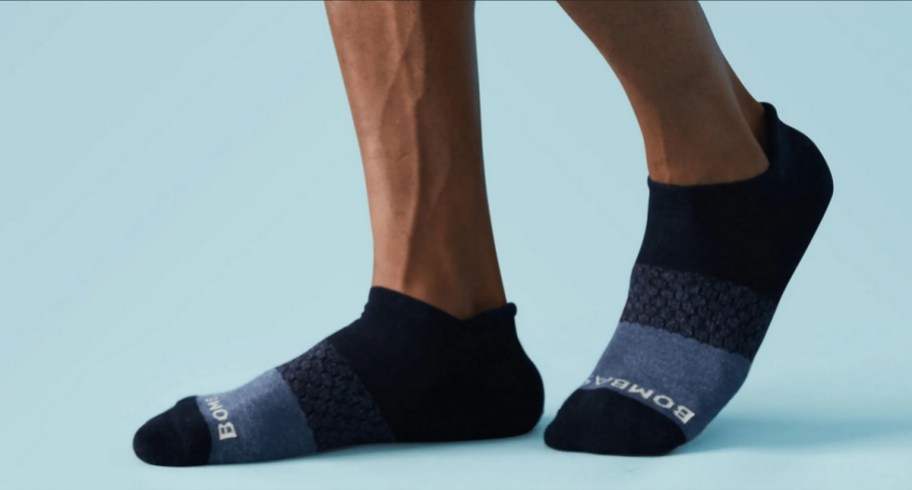 close up of man wearing bombas socks