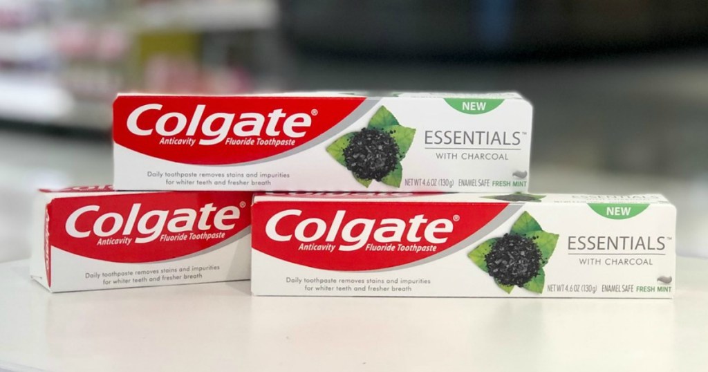 three bottles of colgate essentials wit charcoal