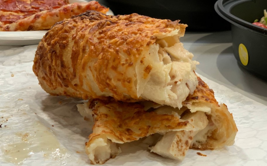 Costco Chicken Bake cut in half sitting on table