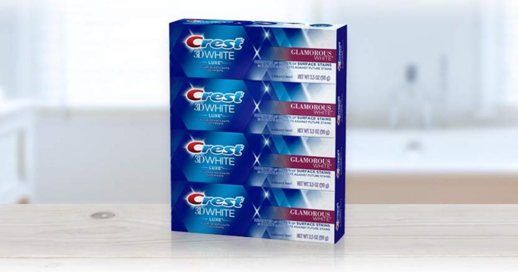 Four pack of Crest toothpaste on counter
