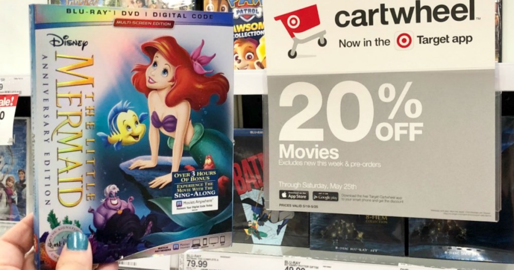 hand holding the little mermaid movie by 20% off cartwheel sign