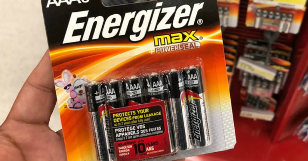hand holding energizer max batteries in store