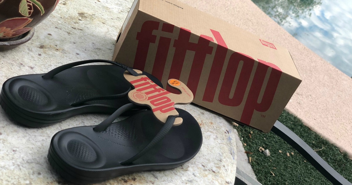 FitFlop sandals and box near a pool