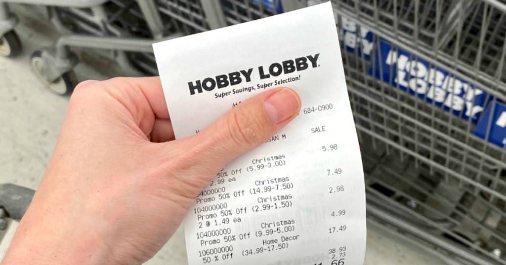 holding Hobby Lobby receipt