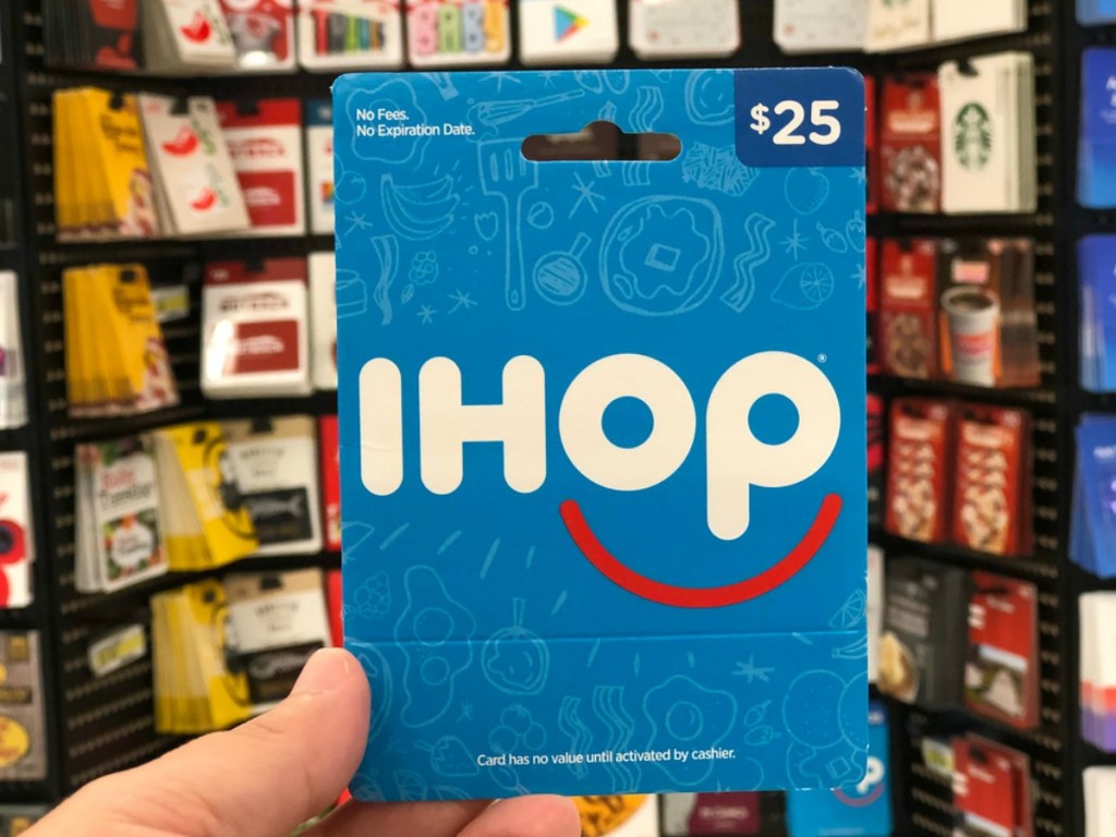 hand holding an ihop gift card