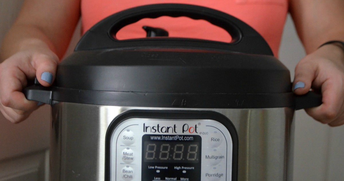 woman holding an instant pot pressure cooker