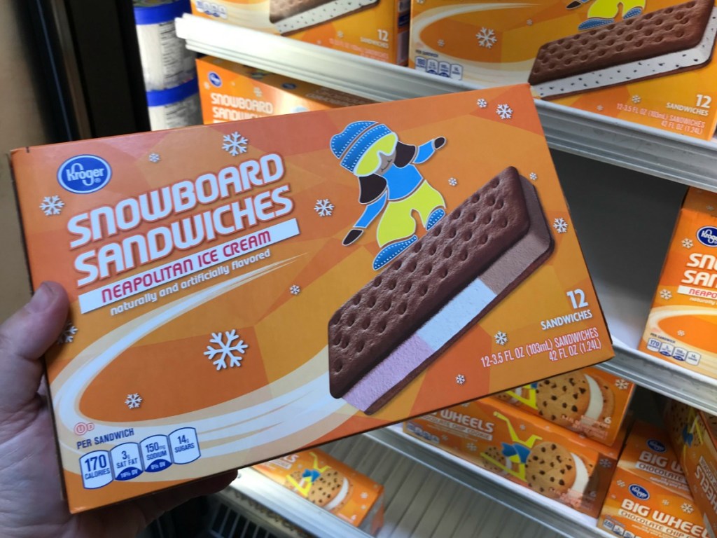 holding a box of ice cream sandwiches