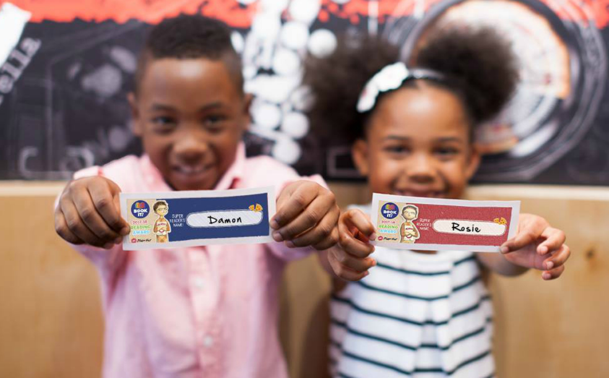 Pizza Hut Book It Summer Reading Program - kids holding out name tags