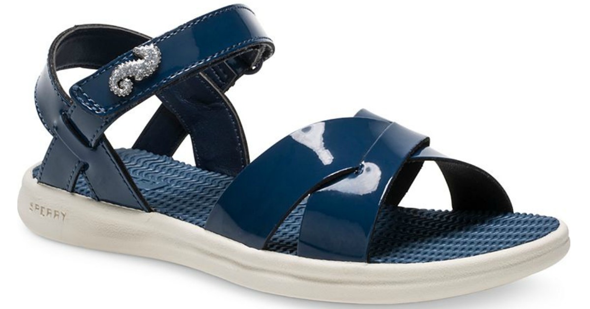pair of blue sperry sandals with silver seahorse details