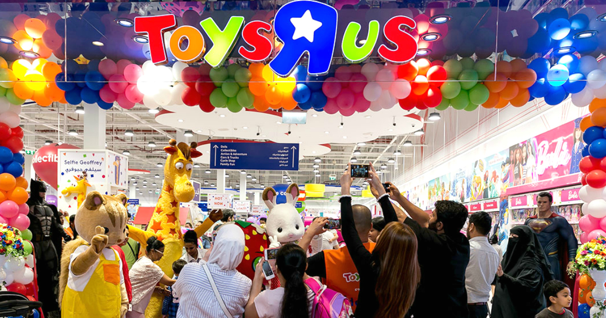 ToysRUs store front with people and balloons