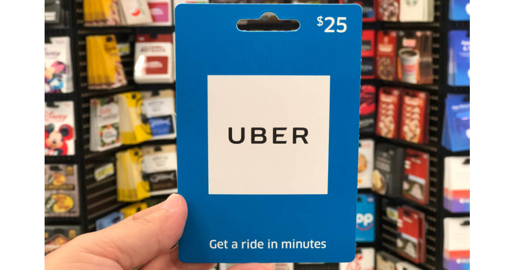 hand holding up uber gift card