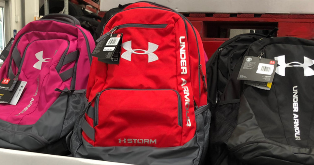 Three Under Armour Backpacks in Black, Pink, and Red
