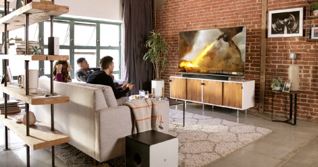 people watching a 4K TV in living room set up while on the couch