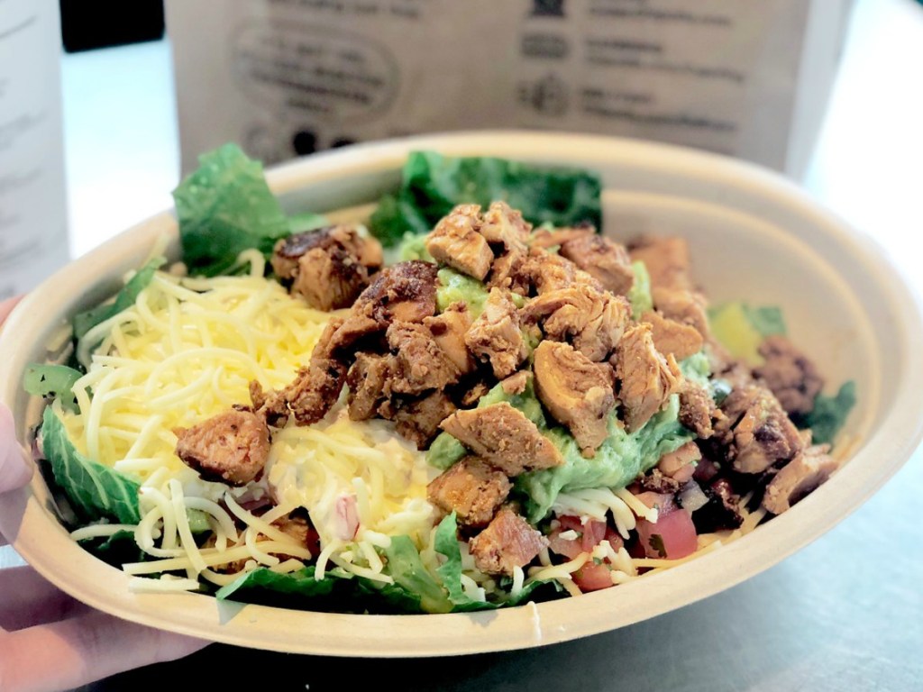 chipotle burrito browl with lettuce, cheese, steak, chidlen