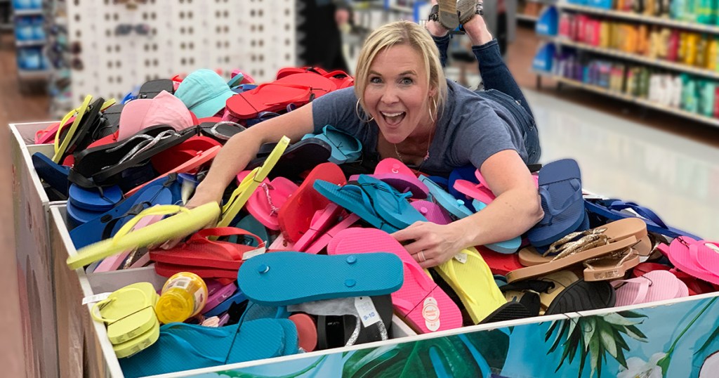 cheap flip flops — collin on a pile of 98¢ flip flops at walmart