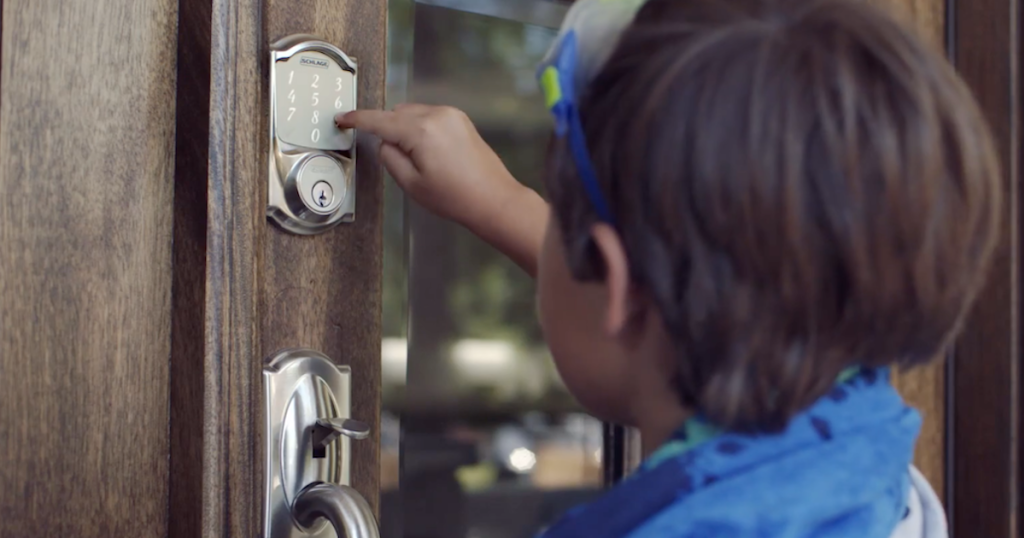 child using digital lock on front door