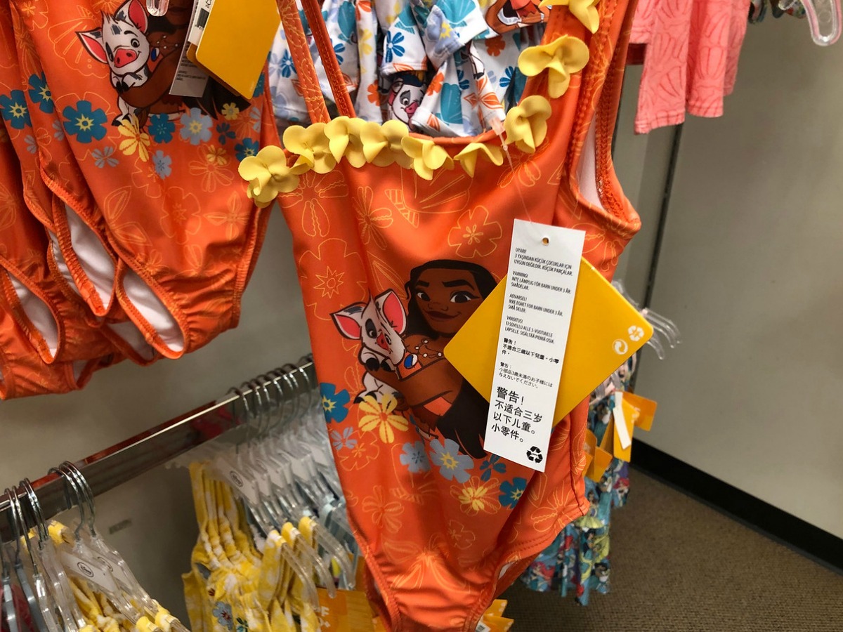 orange swimsuit by store display for kids