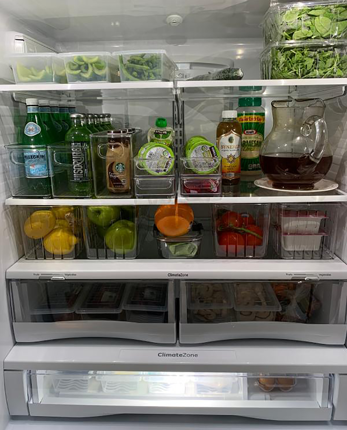 ge fridge open with organized foods