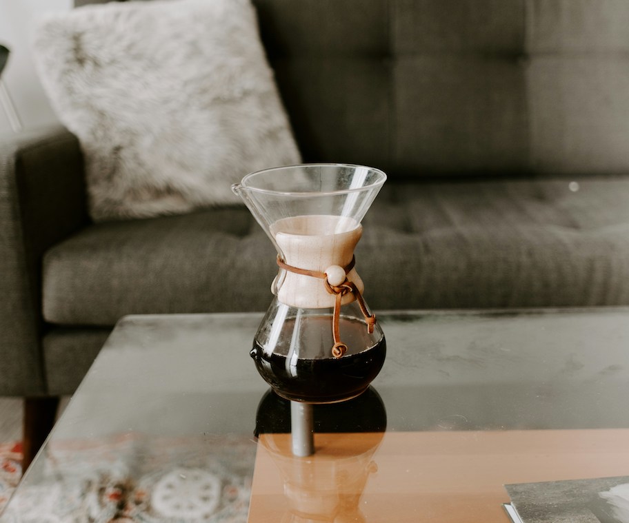 clear coffee table with pour over chemex brewer on top