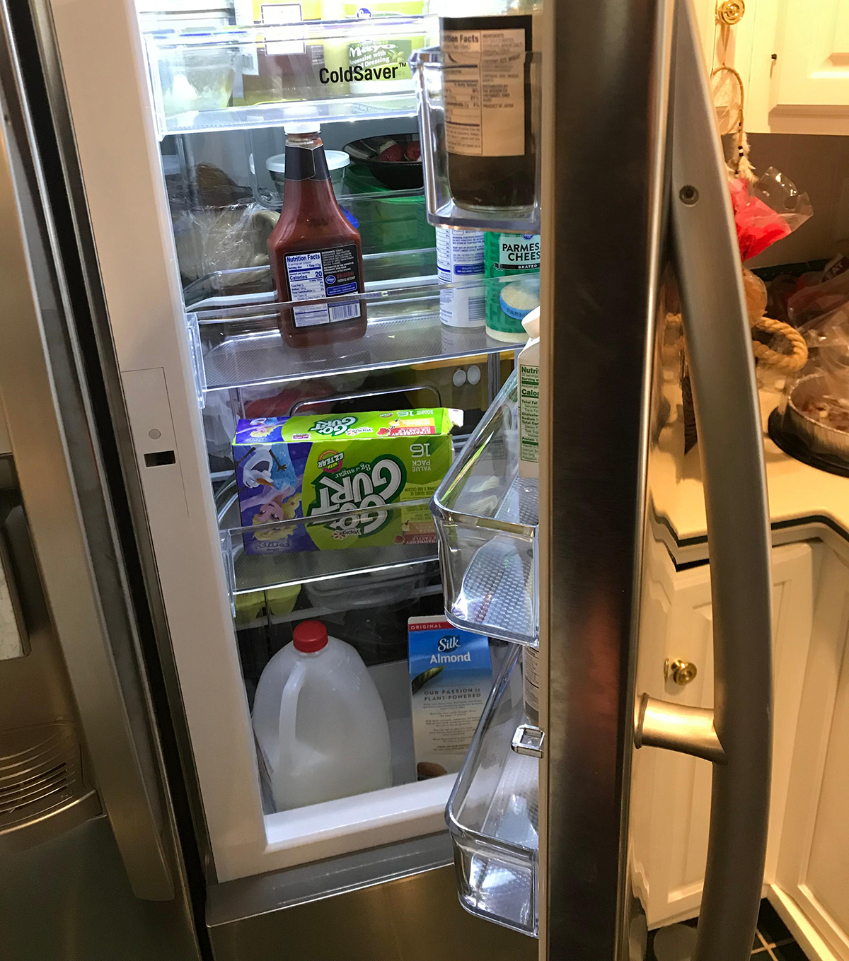 open lg side by side fridge with 3rd door
