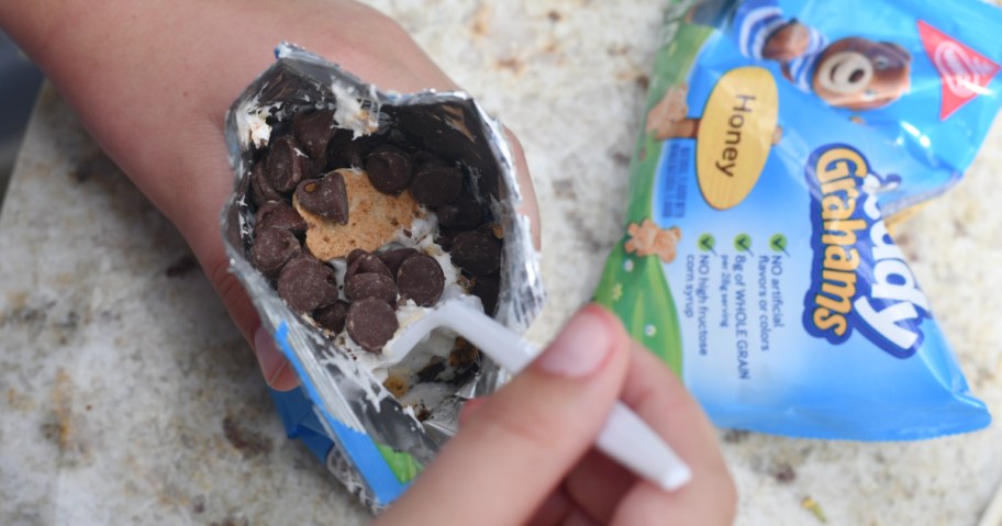mixing marshmallows and chocolate chips in a bag