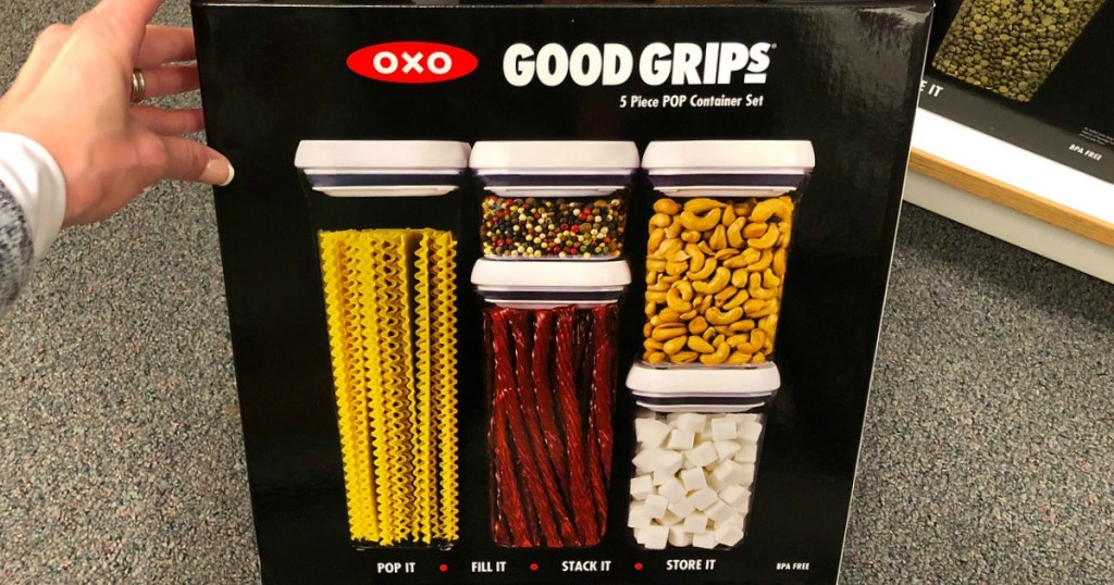 hands holding oxo good grips in store
