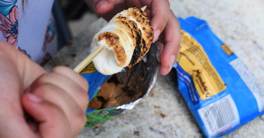 roasted marshmallows being used for s'mores in a bag