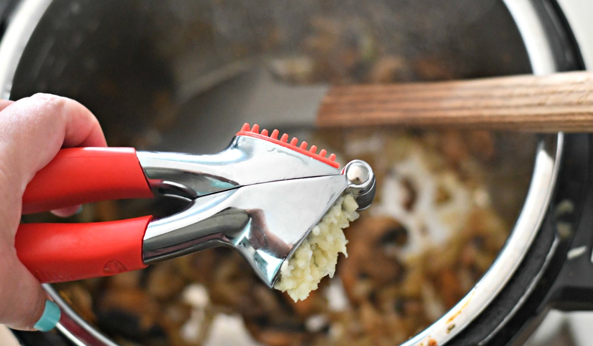 using a garlic press for ease in recipes