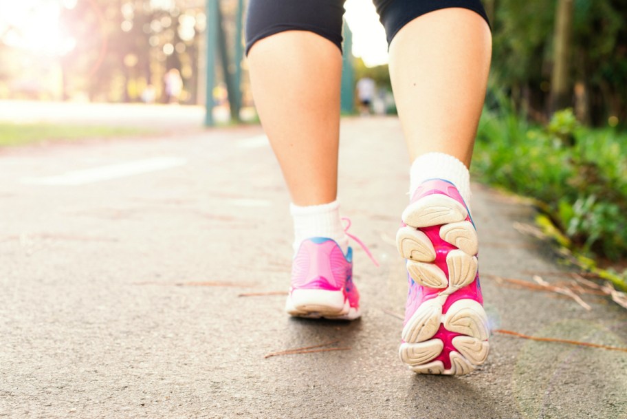 close up of woman wearing sneakers in active step