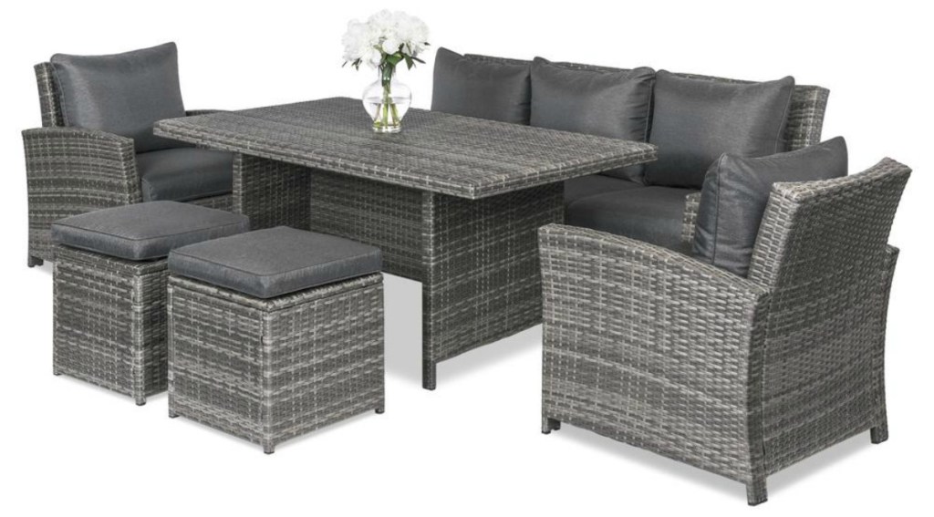 grey wicker outdoor patio set with stools, chairs, couch and table