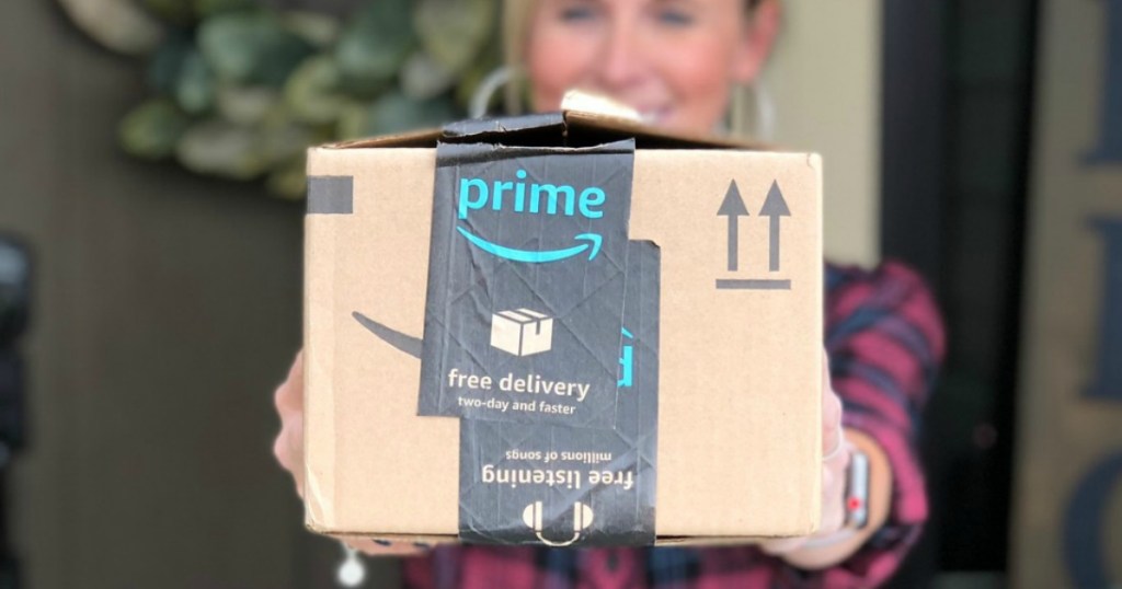 woman holding Amazon Prime box 
