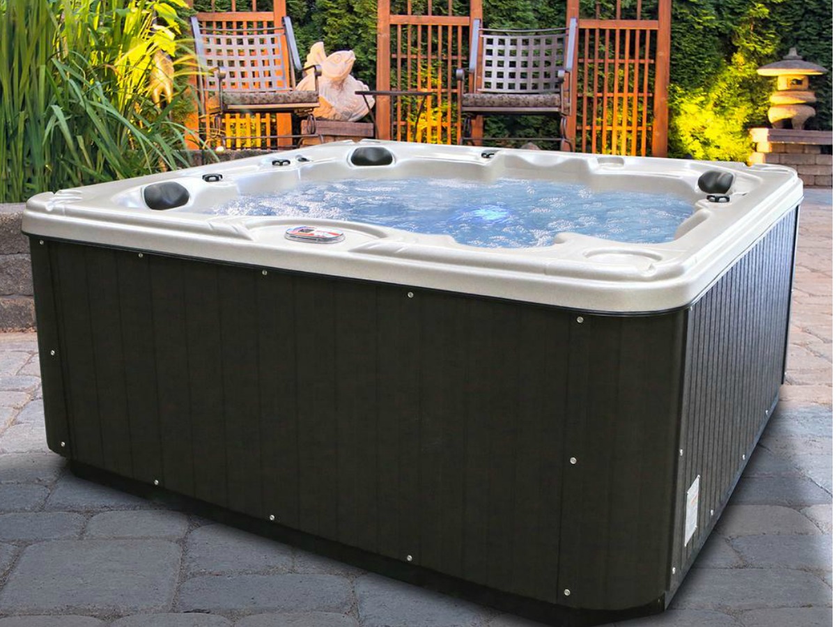 extra large spa hot tub filled and in garden area