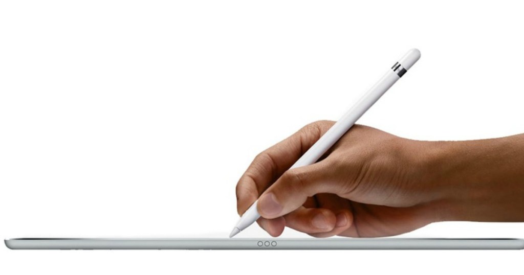 hand using apple pencil to write on tablet