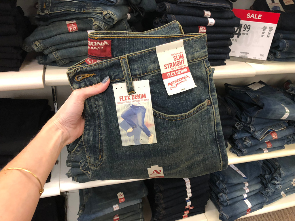 Arizona Men's Jeans being held by a woman's hand