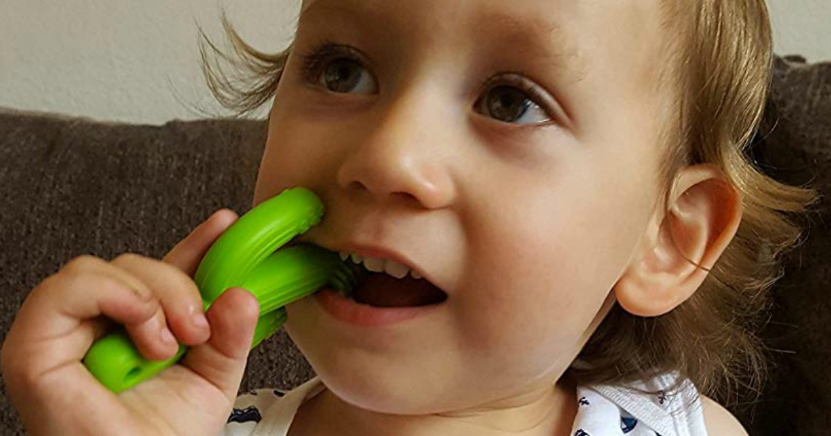 toddler chewing on teether
