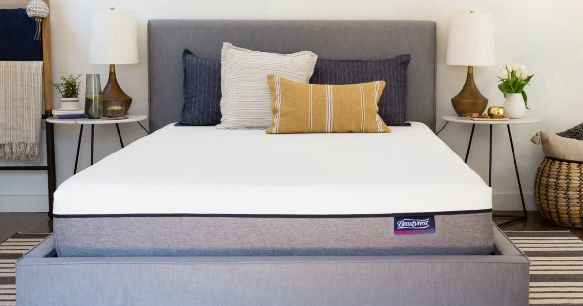 plush mattress with gray bedframe and colorful pillows