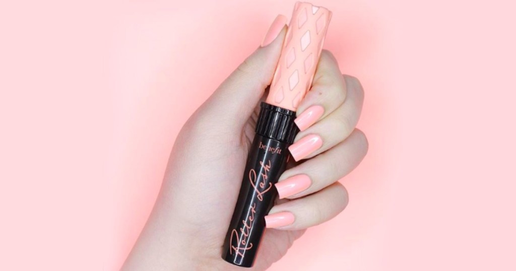 Woman's hand holding Benefit Cosmetics Roller Lash Mascara out of box