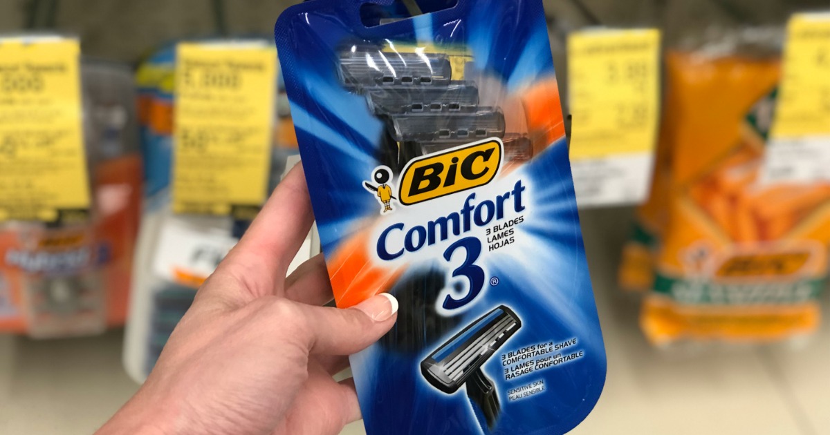 bic comfort 3 disposable razors 4-pack being held in walgreens store