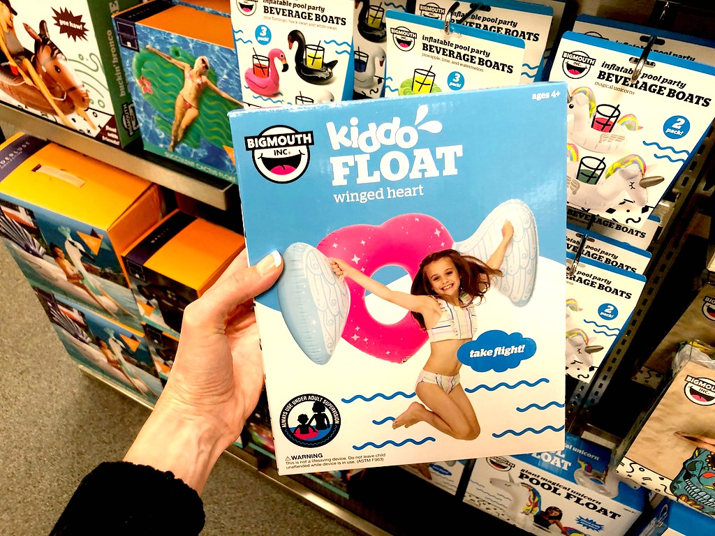 pool float being held by a woman in front of other pool floats at Kohl's