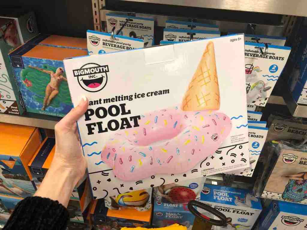 hand holding box of BigMouth melting ice cream pool float