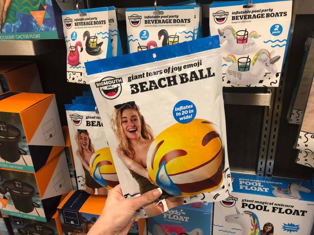 hand holding BigMouth beach ball package