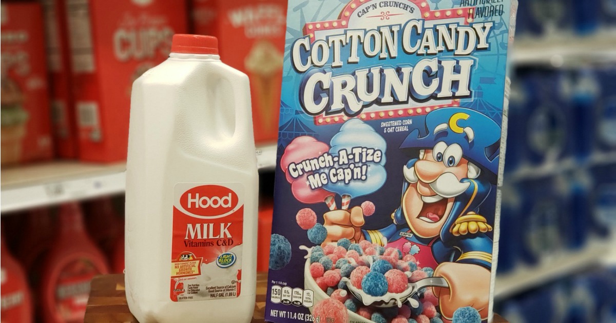 Quart of milk next to cotton candy crunch cereal on counter