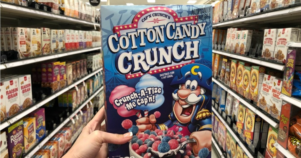 Holding up box of Cap'n Crunch Cotton Candy Cereal in Target aisle