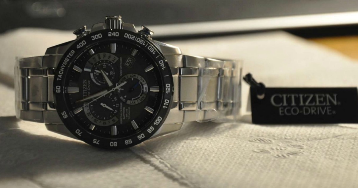 Citizen Men's watch with tag laying on table