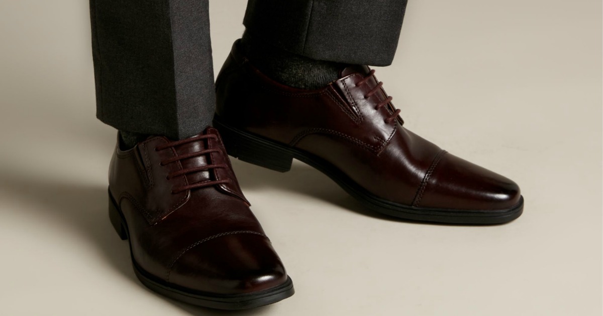 Man wearing dark brown leather Clarks dress shoes