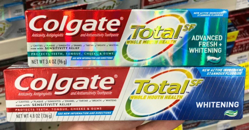 two boxes of colgate total toothpaste