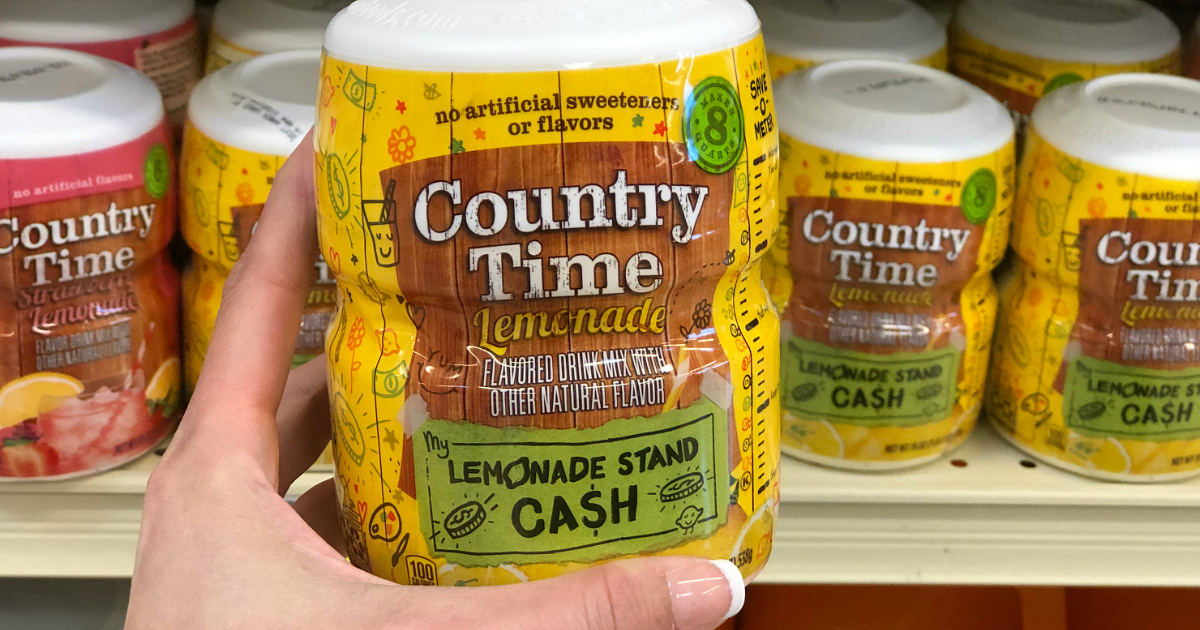 person holding Country Time lemonade in store