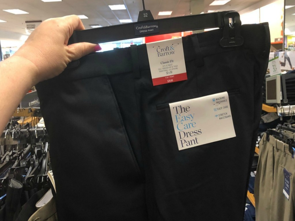 Men's black dress pants on hanger